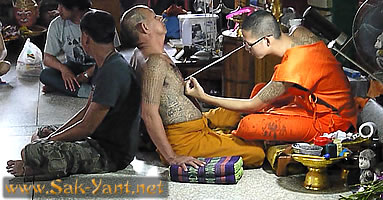 Monk is tattooing monk